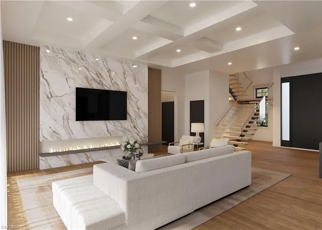 a living room with fireplace furniture and a flat screen tv