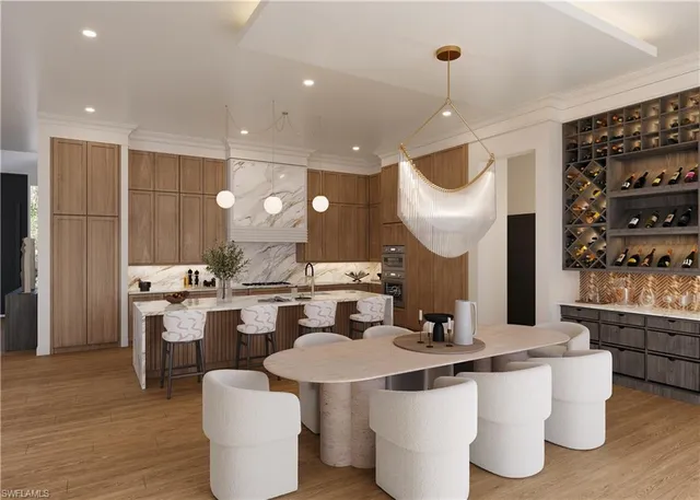 a kitchen with a sink and chairs