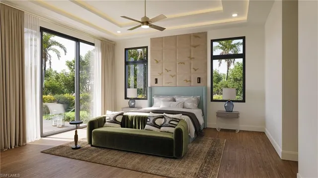 a bedroom with furniture and a large window