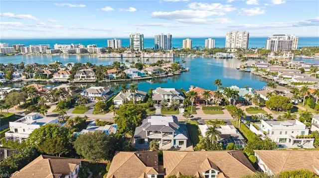 a view of a house with a patio and a fire pit