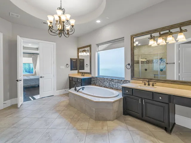 a bathroom with a glass shower door