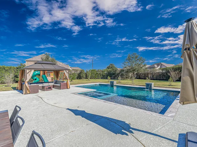 a view of a house with a small yard