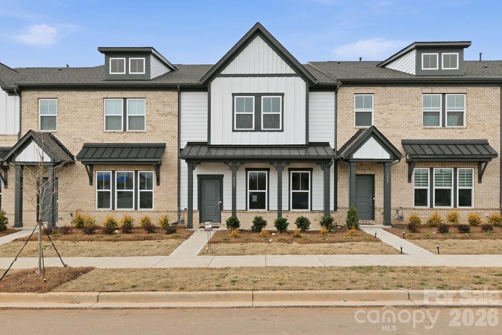 8668 Miles Gap Road Indian Land, SC 29707 - Photo 1 of 28 a front view of a house with a yard