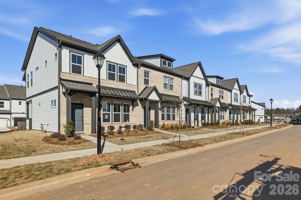 8668 Miles Gap Road Indian Land, SC 29707 - Photo 2 of 28 a front view of a building with a street
