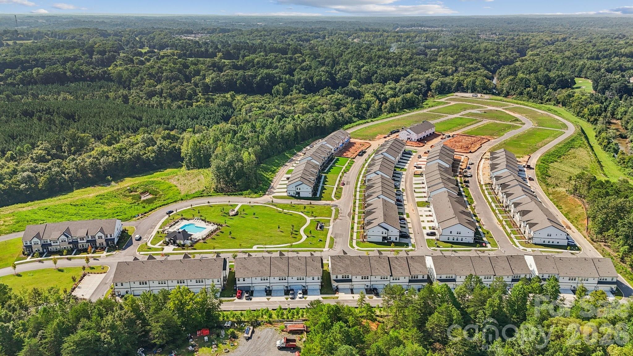 8668 Miles Gap Road Indian Land, SC 29707 - Photo 21 of 28 an aerial view of a swimming pool with a yard and outdoor seating