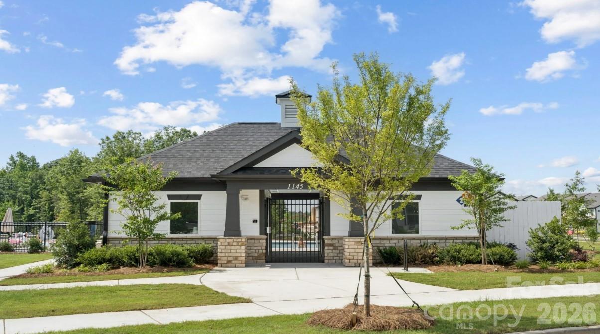 8668 Miles Gap Road Indian Land, SC 29707 - Photo 26 of 28 a front view of a house with garden