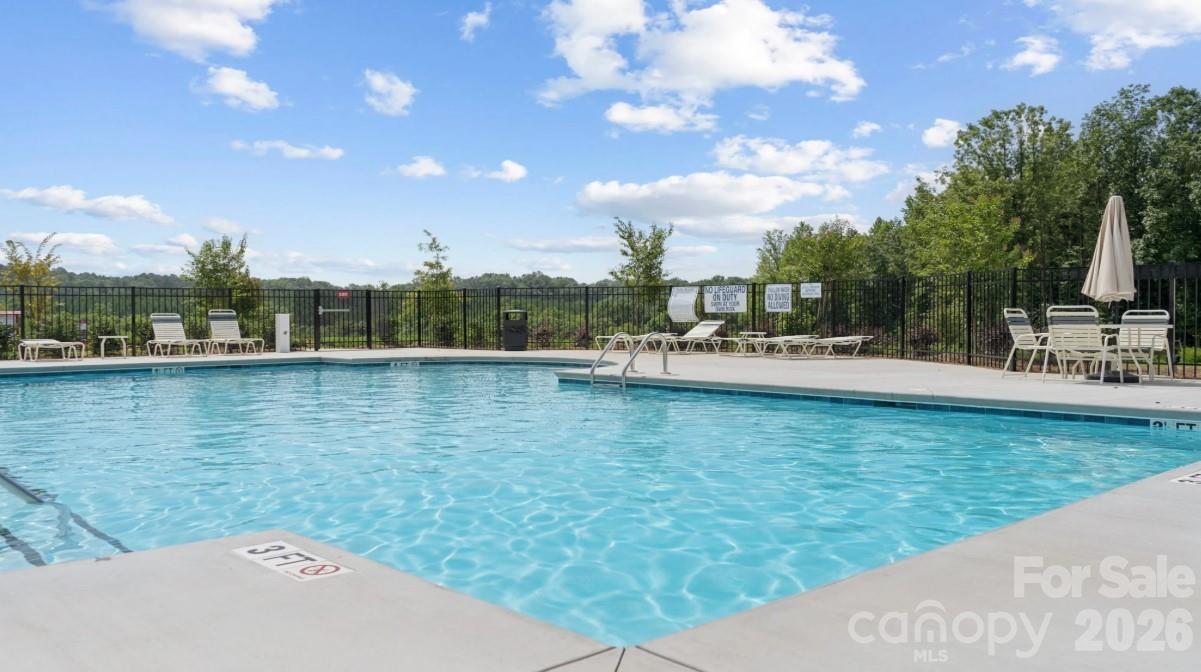 8668 Miles Gap Road Indian Land, SC 29707 - Photo 27 of 28 a view of a lake with houses
