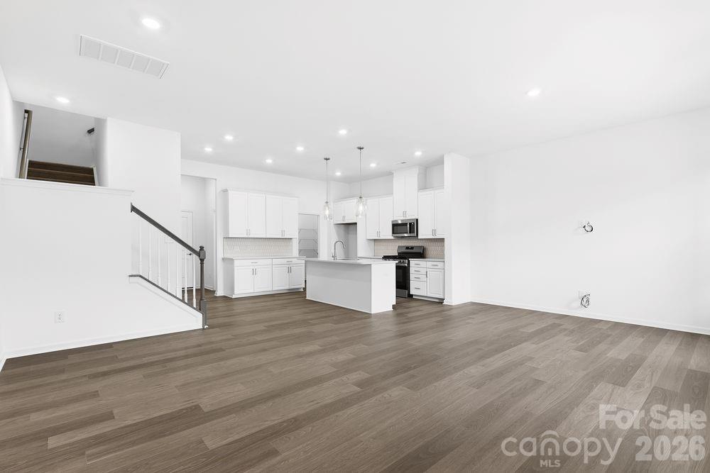 8668 Miles Gap Road Indian Land, SC 29707 - Photo 5 of 28 a view of kitchen with wooden floor and electronic appliances