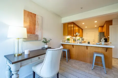 a kitchen with a table and chairs in it