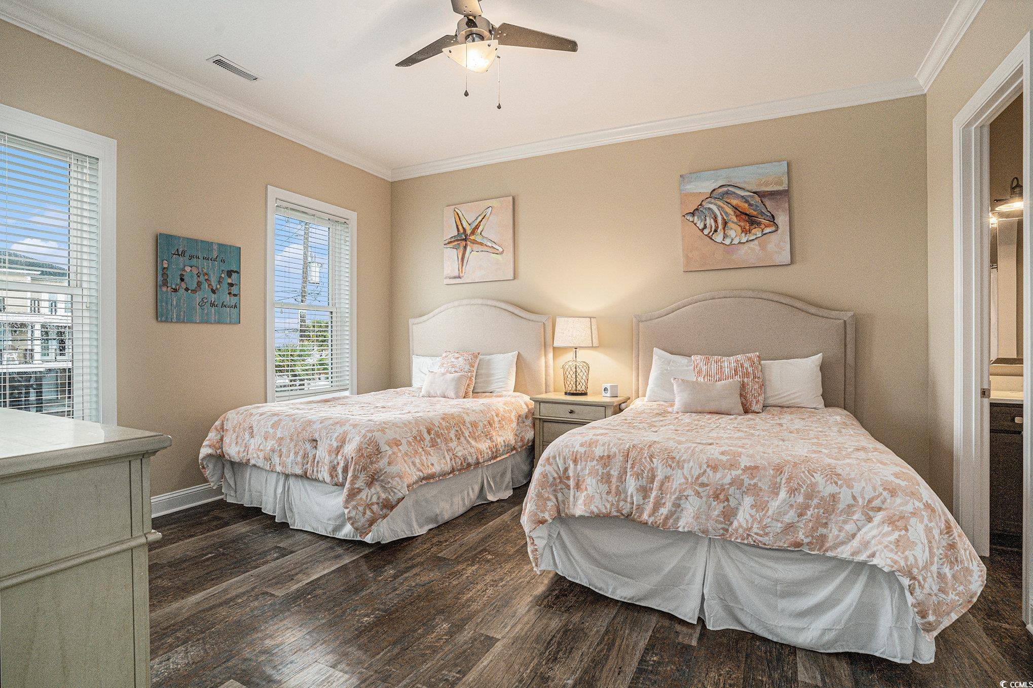 1907 South Waccamaw Drive Murrells Inlet, SC 29576 - Photo 18 of 40 Bedroom featuring ceiling fan, dark hardwood / wood-style floors, and crown molding