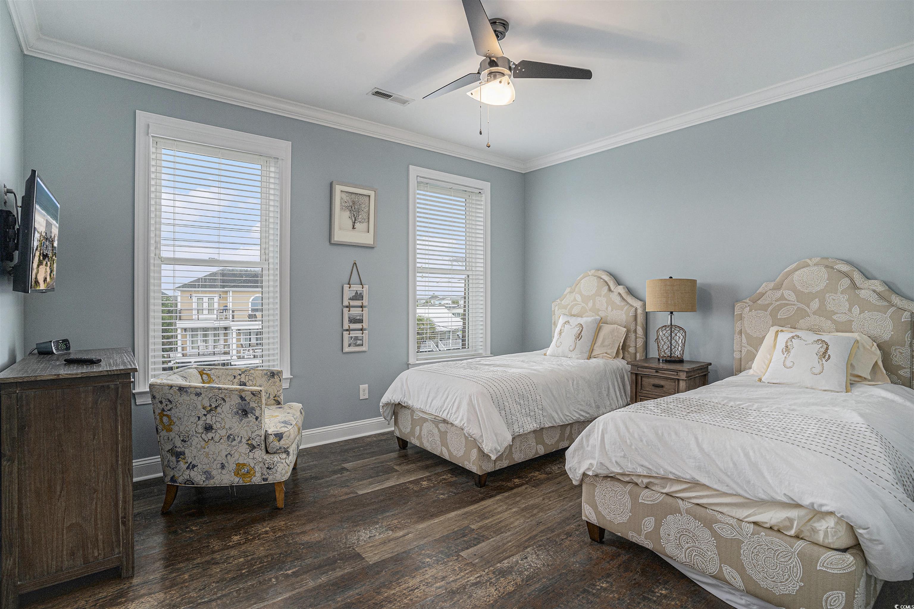 1907 South Waccamaw Drive Murrells Inlet, SC 29576 - Photo 23 of 40 Bedroom with crown molding, multiple windows, ceiling fan, and wood-type flooring