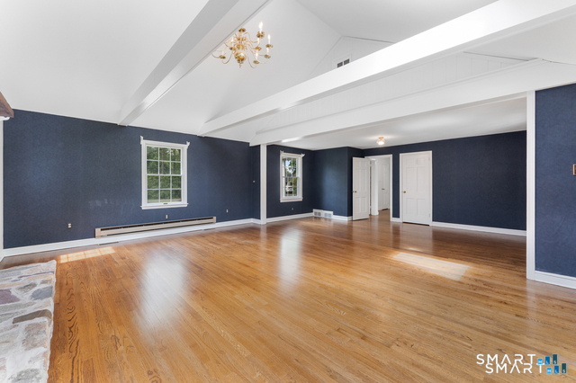 62 Chatham Road Berlin, CT 06037 - Photo 14 of 38 a view of an empty room with window and wooden floor