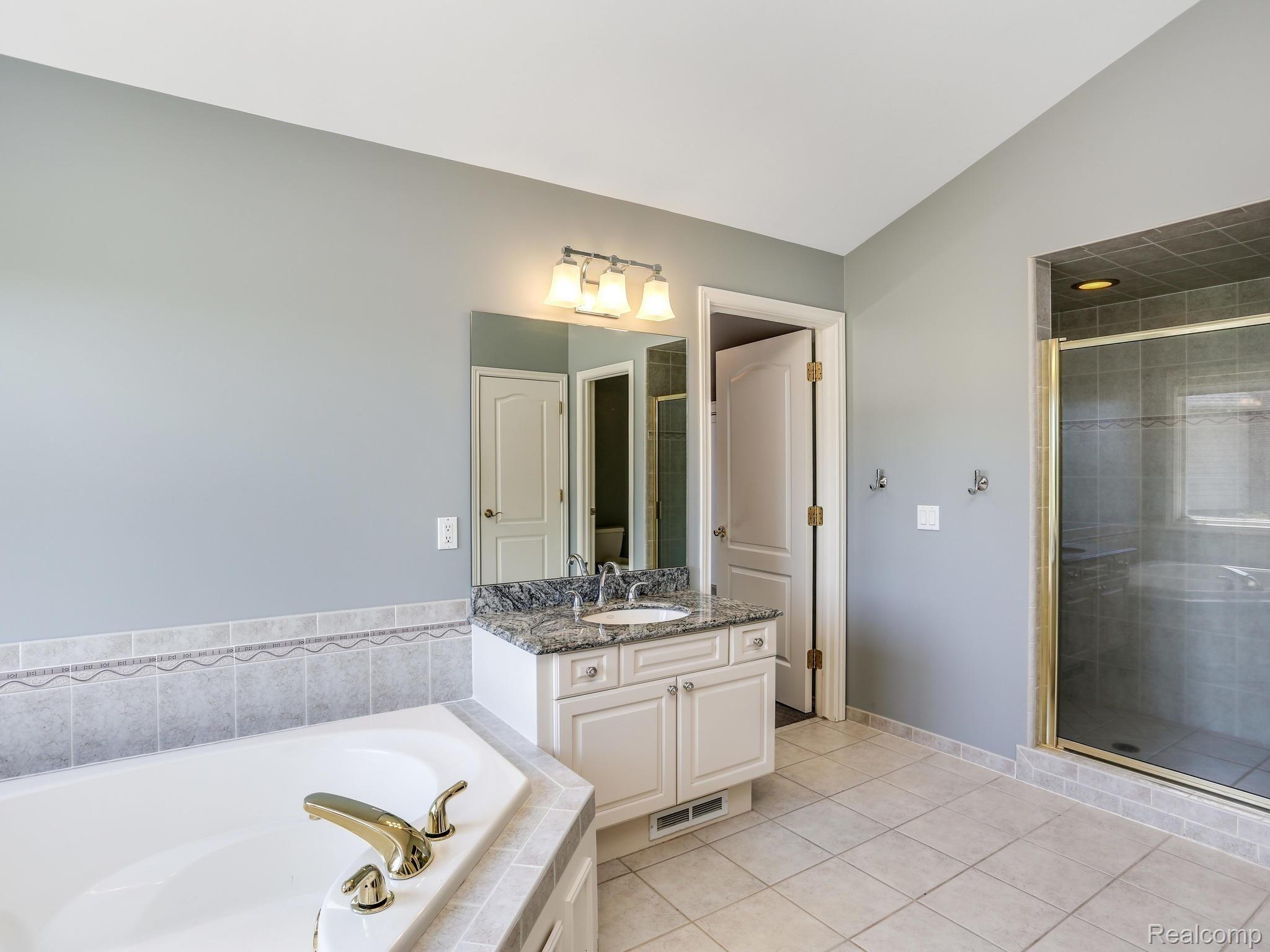 5323 Carlisle Court Rochester, MI 48306 - Photo 37 of 57 Master bath with his and her's sinks.