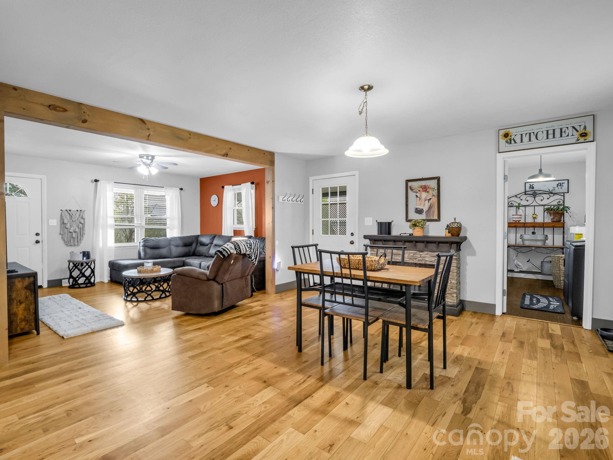 248 Bible School Road Lake Lure, NC 28746 - Photo 21 of 38 a living room with furniture a fireplace and a table