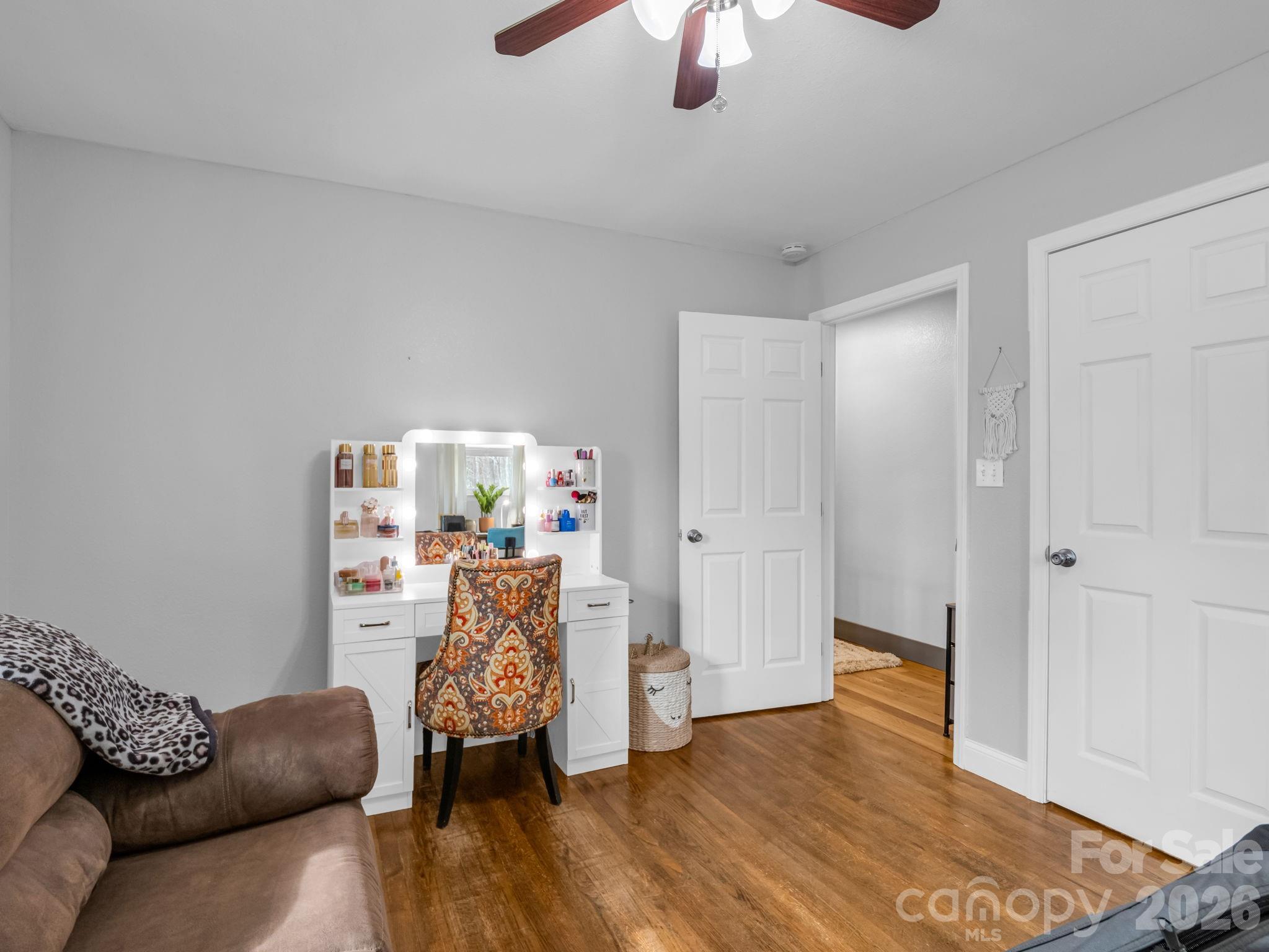 248 Bible School Road Lake Lure, NC 28746 - Photo 28 of 38 a living room with furniture and wooden floor