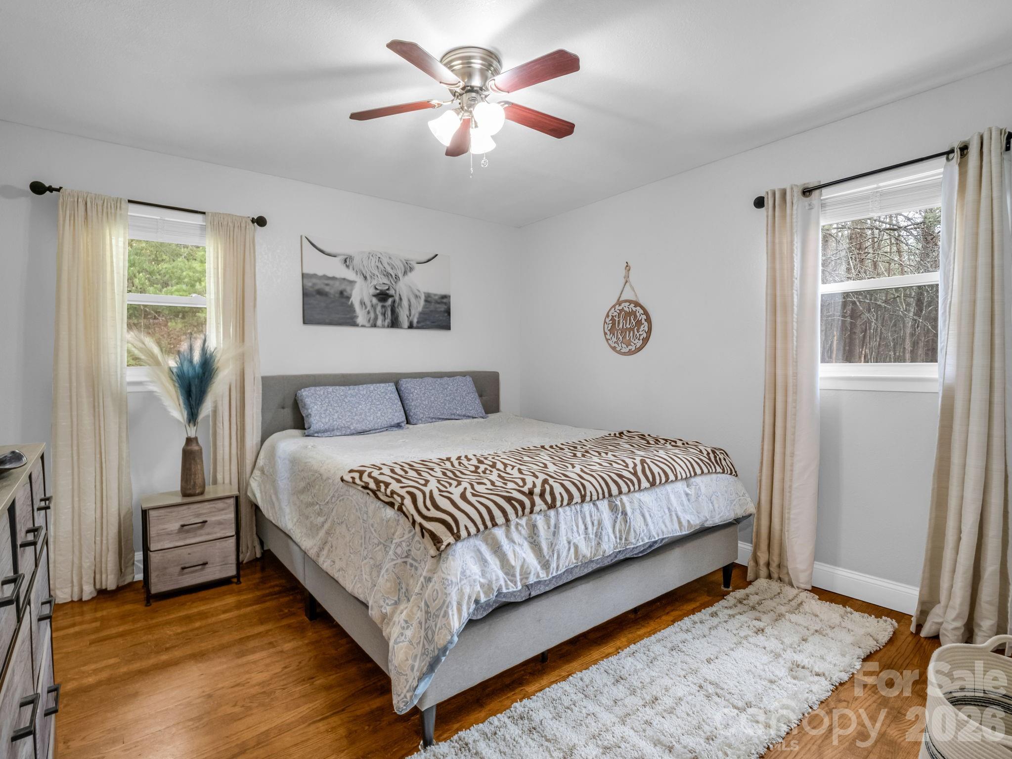 248 Bible School Road Lake Lure, NC 28746 - Photo 29 of 38 a spacious bedroom with a bed and a window