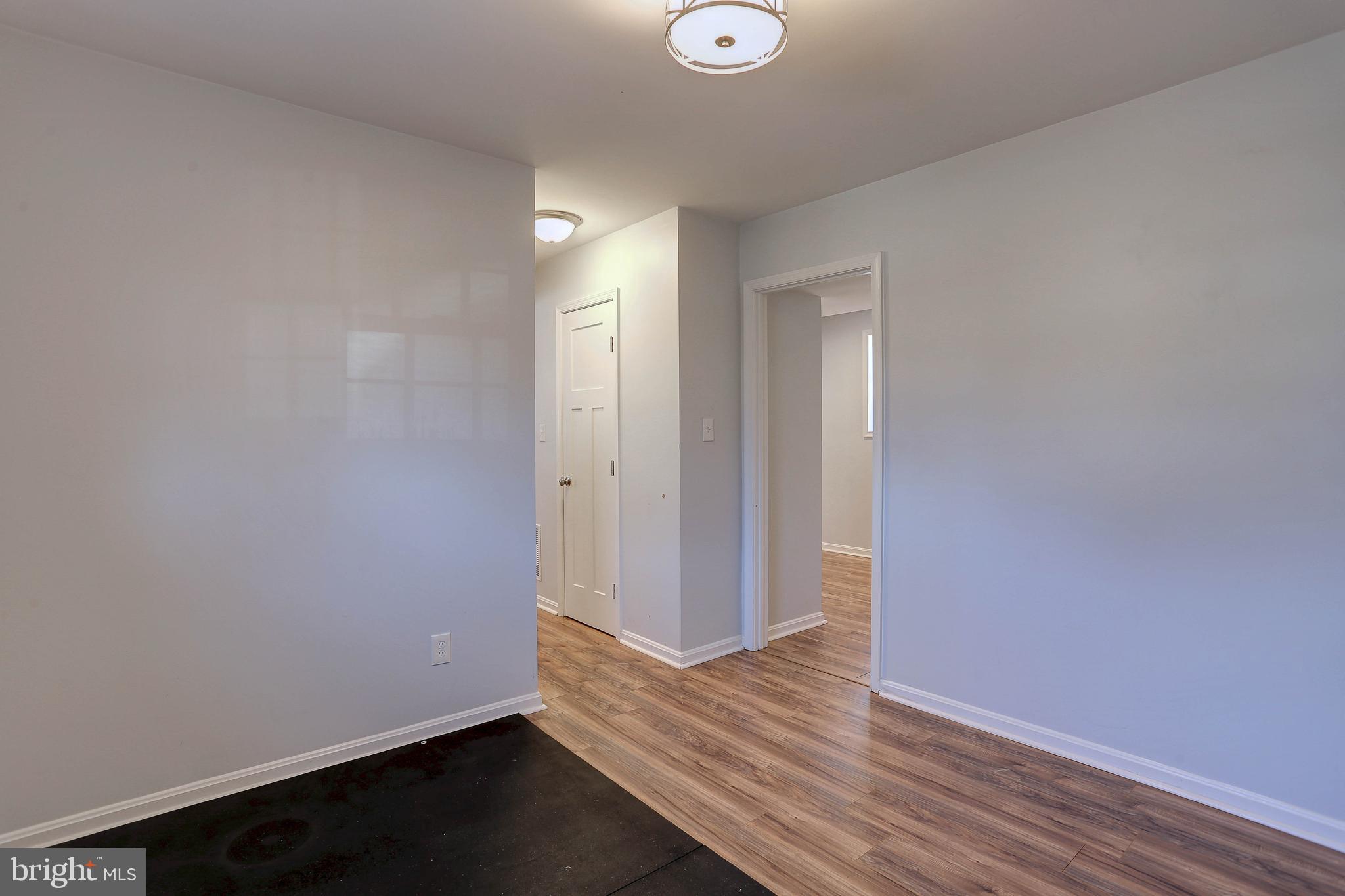 800 A Barrett Avenue Arnold, MD 21012 - Photo 15 of 30 a view of an empty room with wooden floor