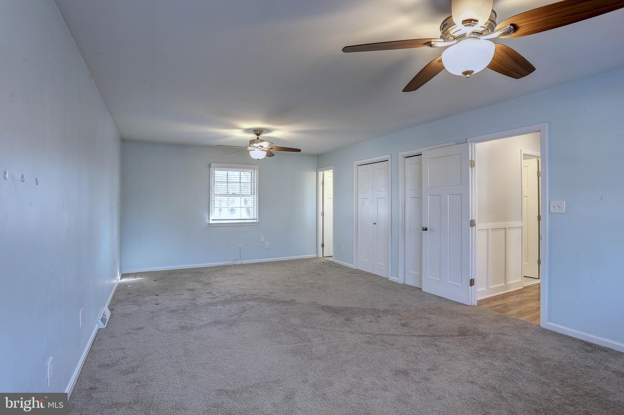 800 A Barrett Avenue Arnold, MD 21012 - Photo 16 of 30 an empty room with chandelier fan and windows