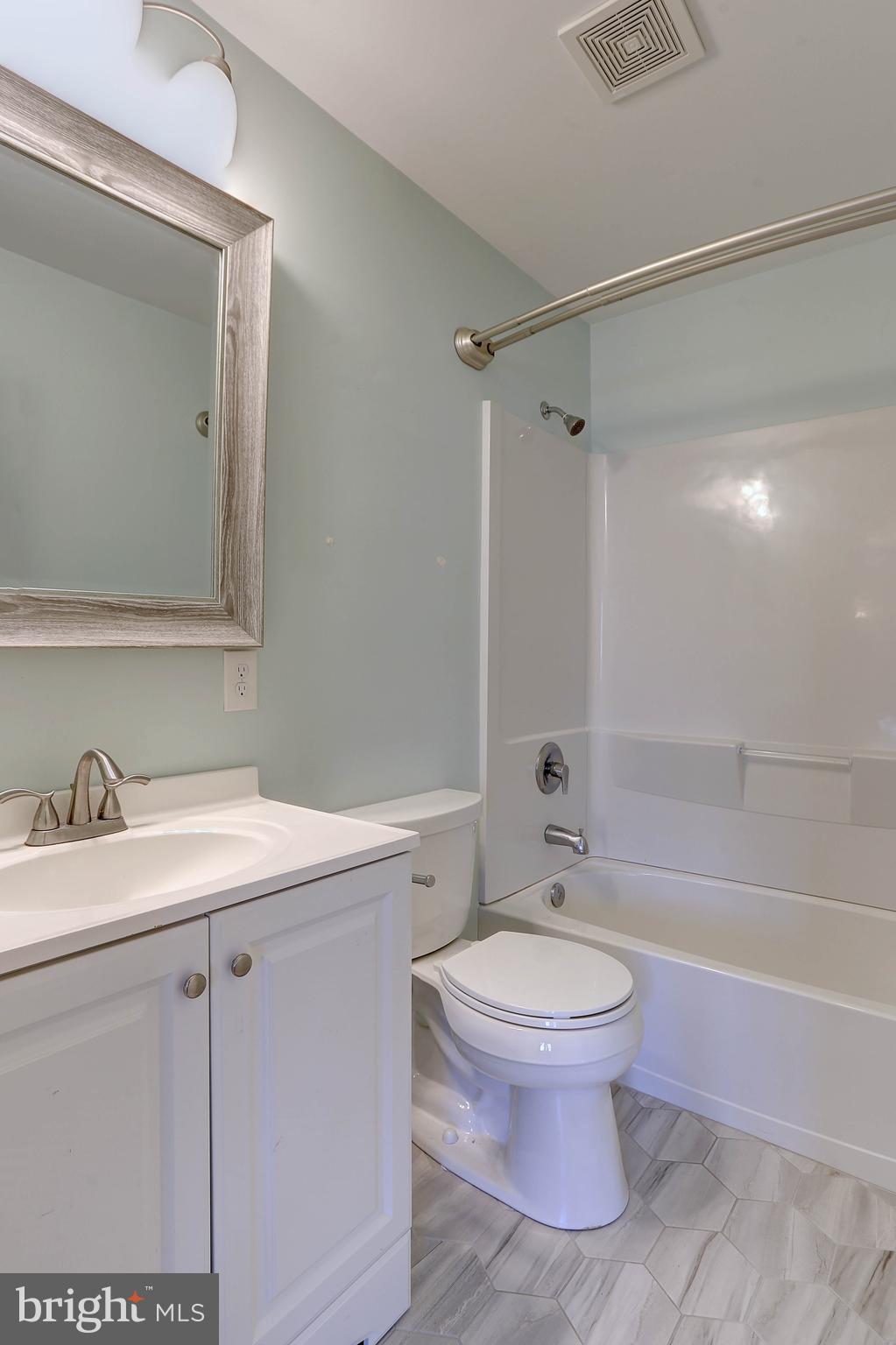 800 A Barrett Avenue Arnold, MD 21012 - Photo 24 of 30 a bathroom with a granite countertop sink toilet a mirror and a bathtub