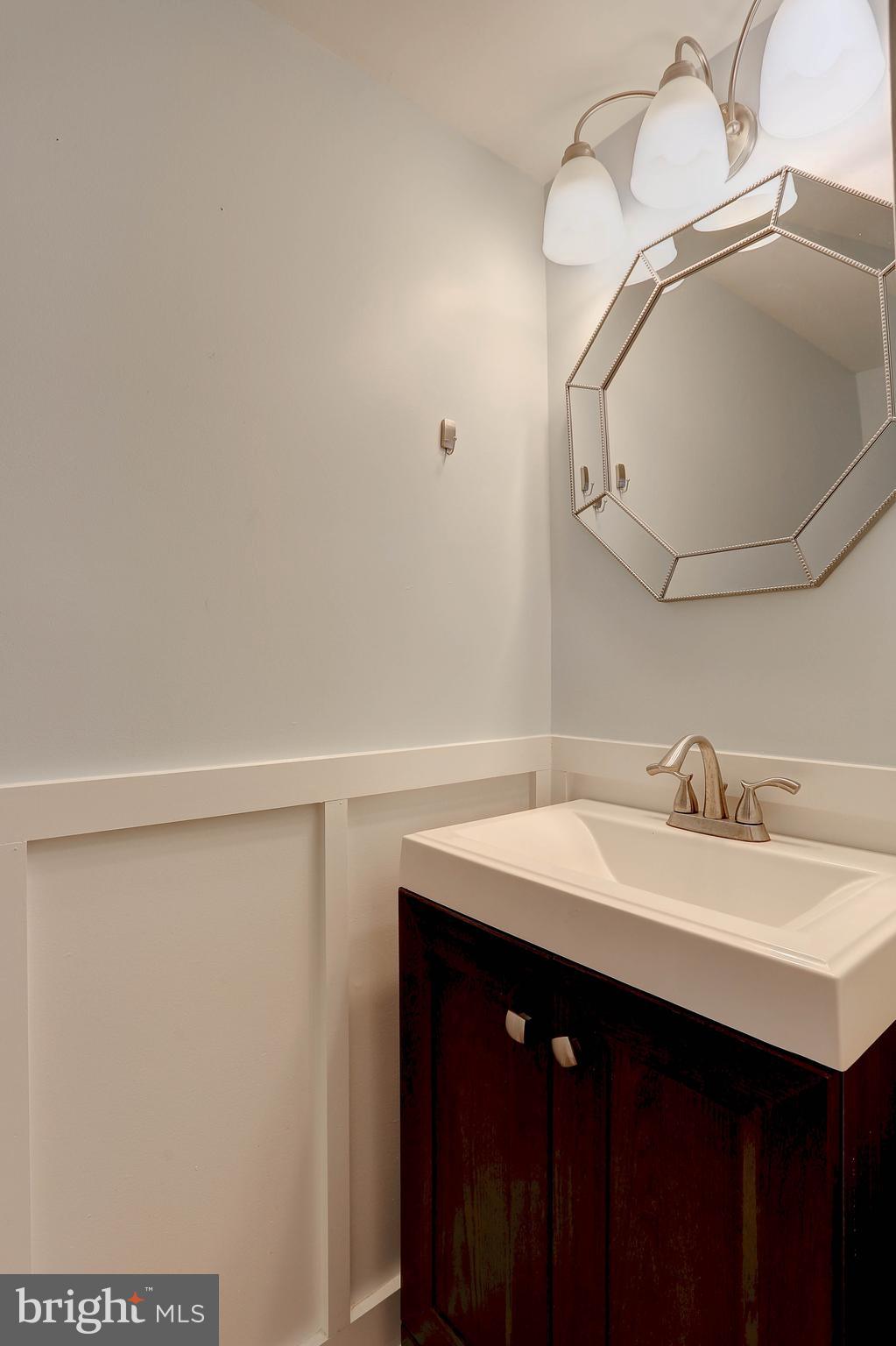 800 A Barrett Avenue Arnold, MD 21012 - Photo 26 of 30 a bathroom with a sink vanity and a mirror