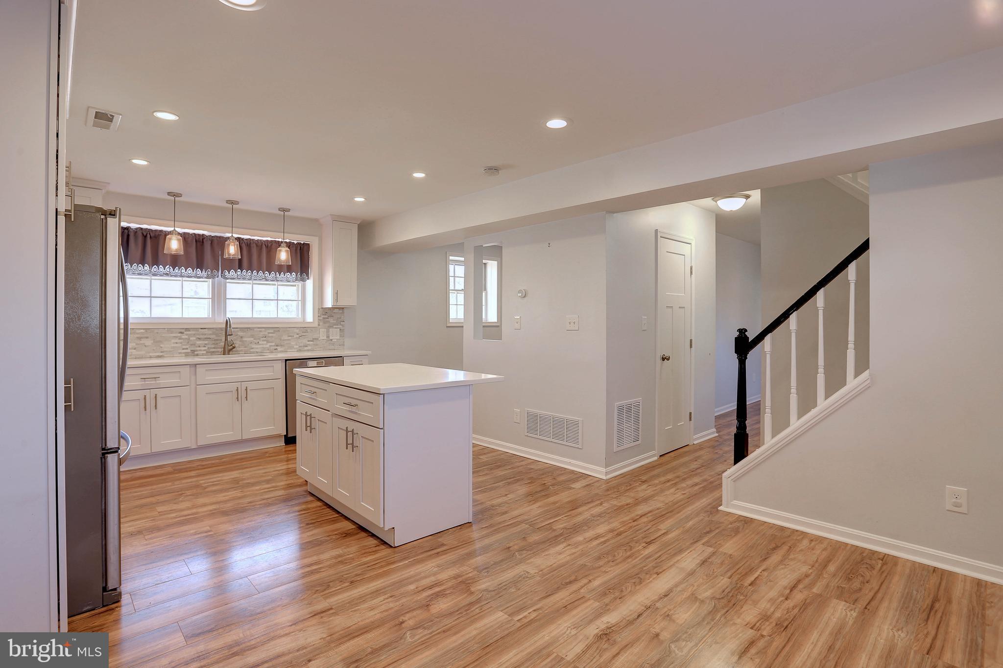 800 A Barrett Avenue Arnold, MD 21012 - Photo 5 of 30 a kitchen with a refrigerator and a stove top oven