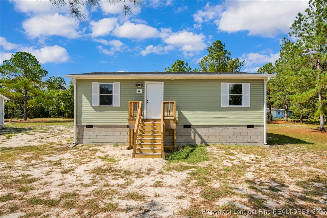 a house view with a backyard space