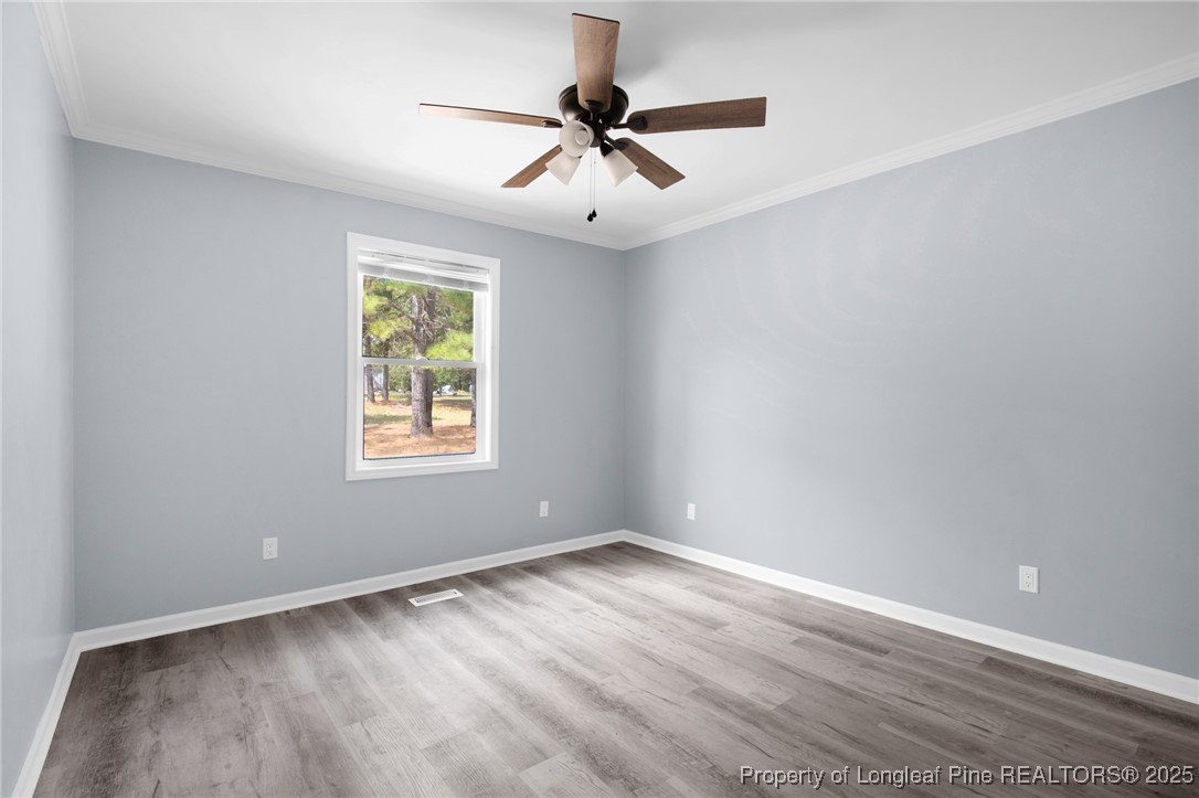 258 Brower Road Cameron, NC 28326 - Photo 14 of 24 wooden floor in an empty room with a window