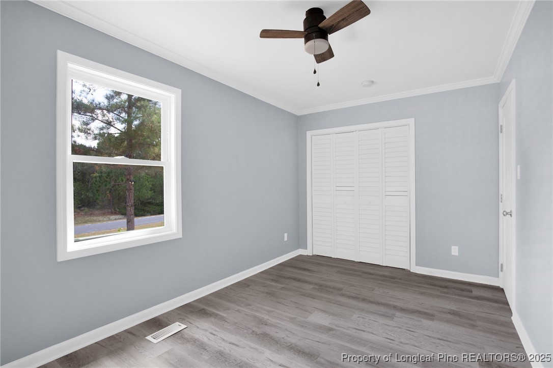 258 Brower Road Cameron, NC 28326 - Photo 18 of 24 a view of empty room with wooden floor and fan