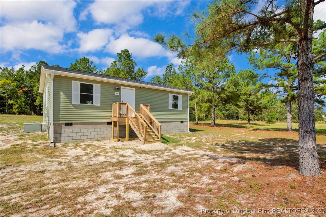 258 Brower Road Cameron, NC 28326 - Photo 2 of 24 a view of a house with backyard