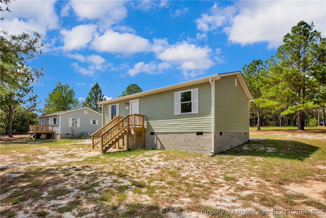 258 Brower Road Cameron, NC 28326 - Photo 3 of 24 a view of a house with a yard