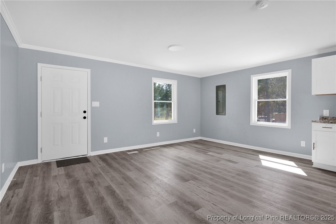 258 Brower Road Cameron, NC 28326 - Photo 6 of 24 a view of an empty room with wooden floor and windows