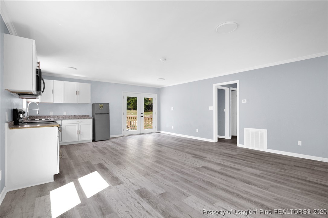 258 Brower Road Cameron, NC 28326 - Photo 7 of 24 a view of a kitchen with a sink and a stove top oven