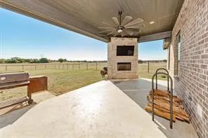 a view of a kitchen with a sink and microwave