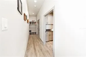 a view of a kitchen from the hallway