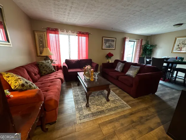 a living room with furniture windows and a window