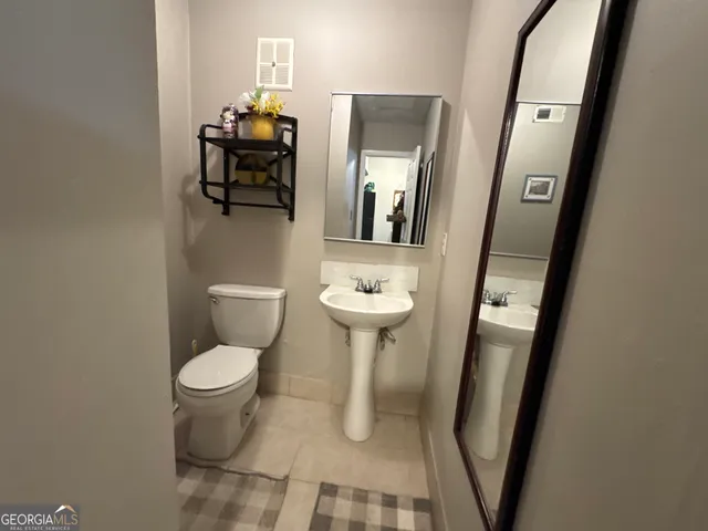 a bathroom with a toilet and a sink