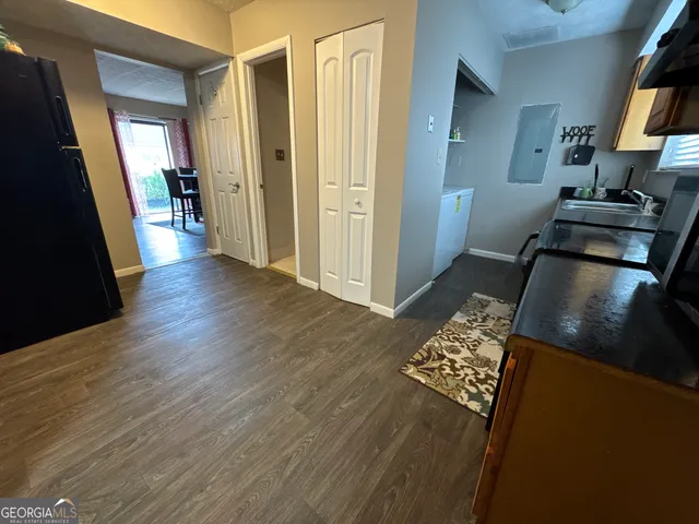 a view of a kitchen from the hallway