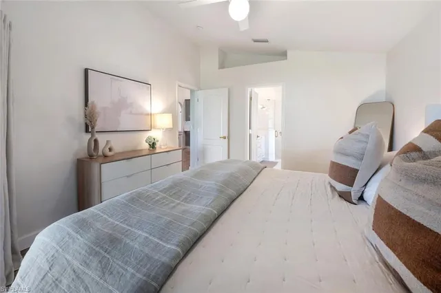 a bedroom with a bed and a dresser
