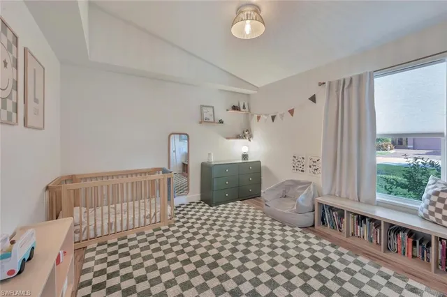 a bedroom with furniture and a window