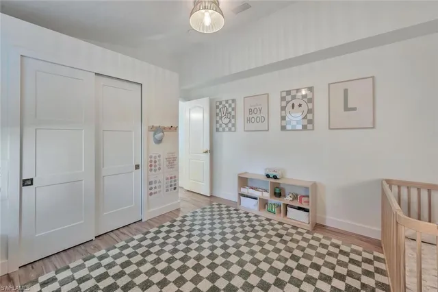 a living room with a couch and a view of a bathroom