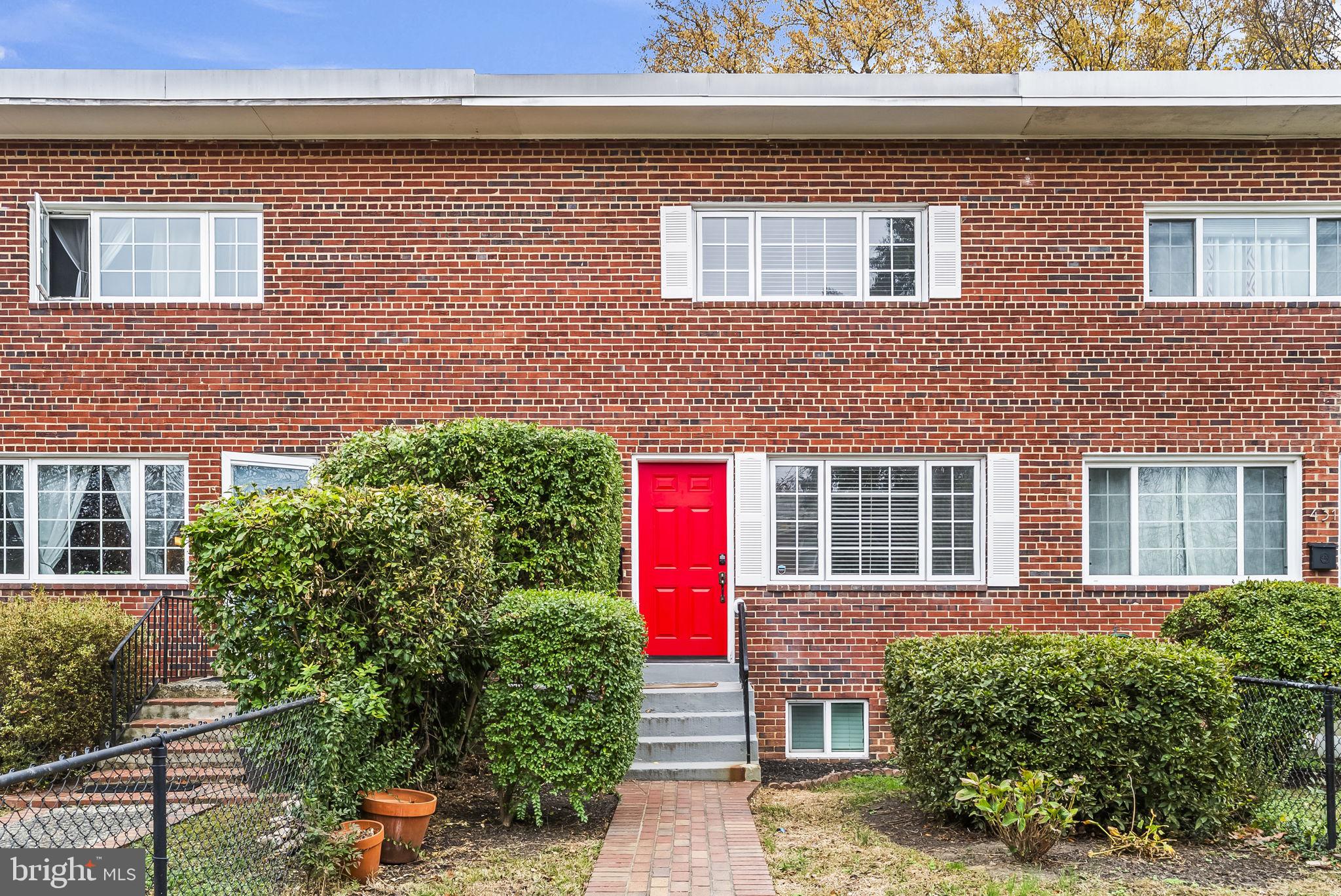 433 Earl Street Alexandria, VA 22314 - Photo 1 of 30 a front view of a house with a yard