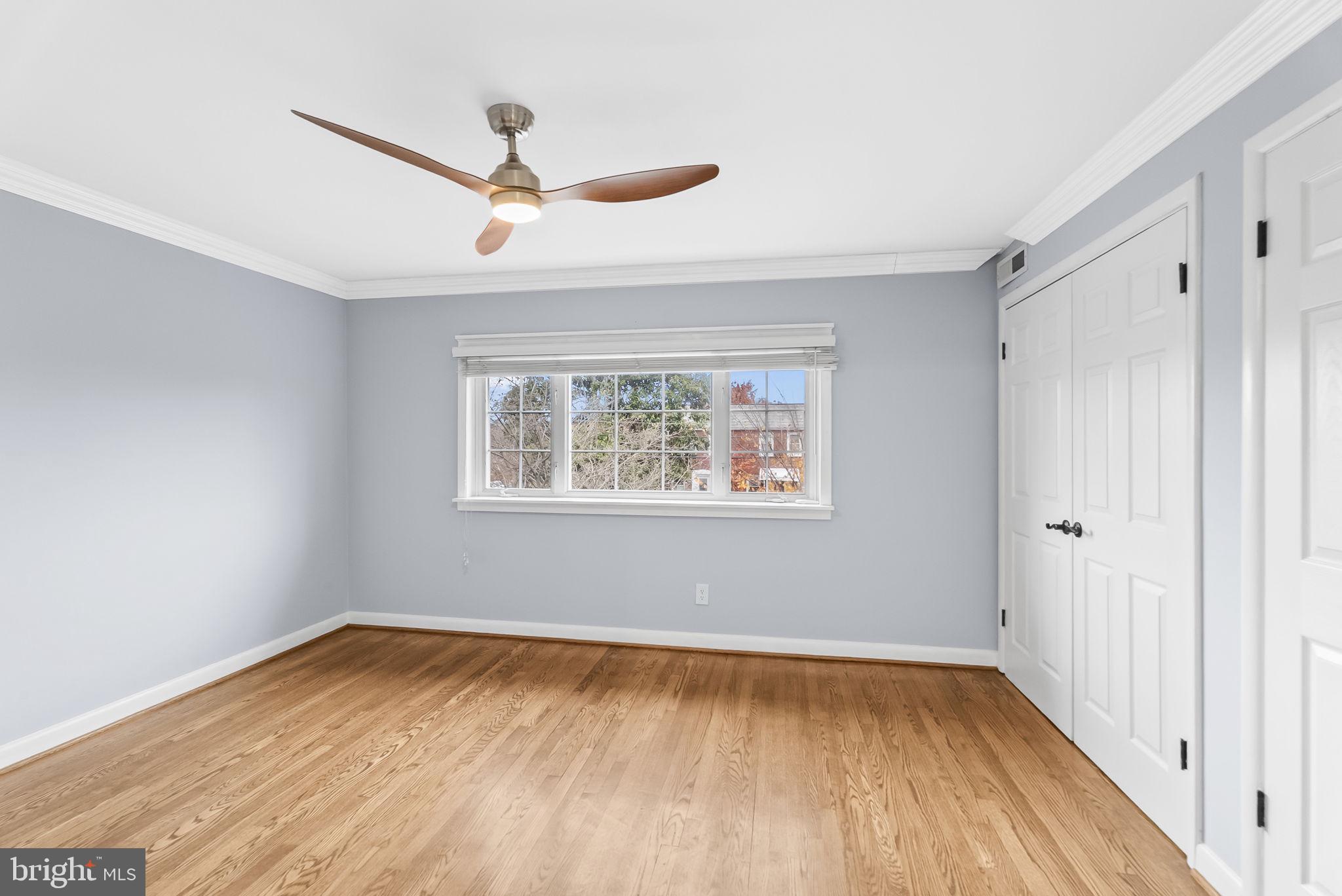 433 Earl Street Alexandria, VA 22314 - Photo 14 of 30 a view of empty room with wooden floor and fan