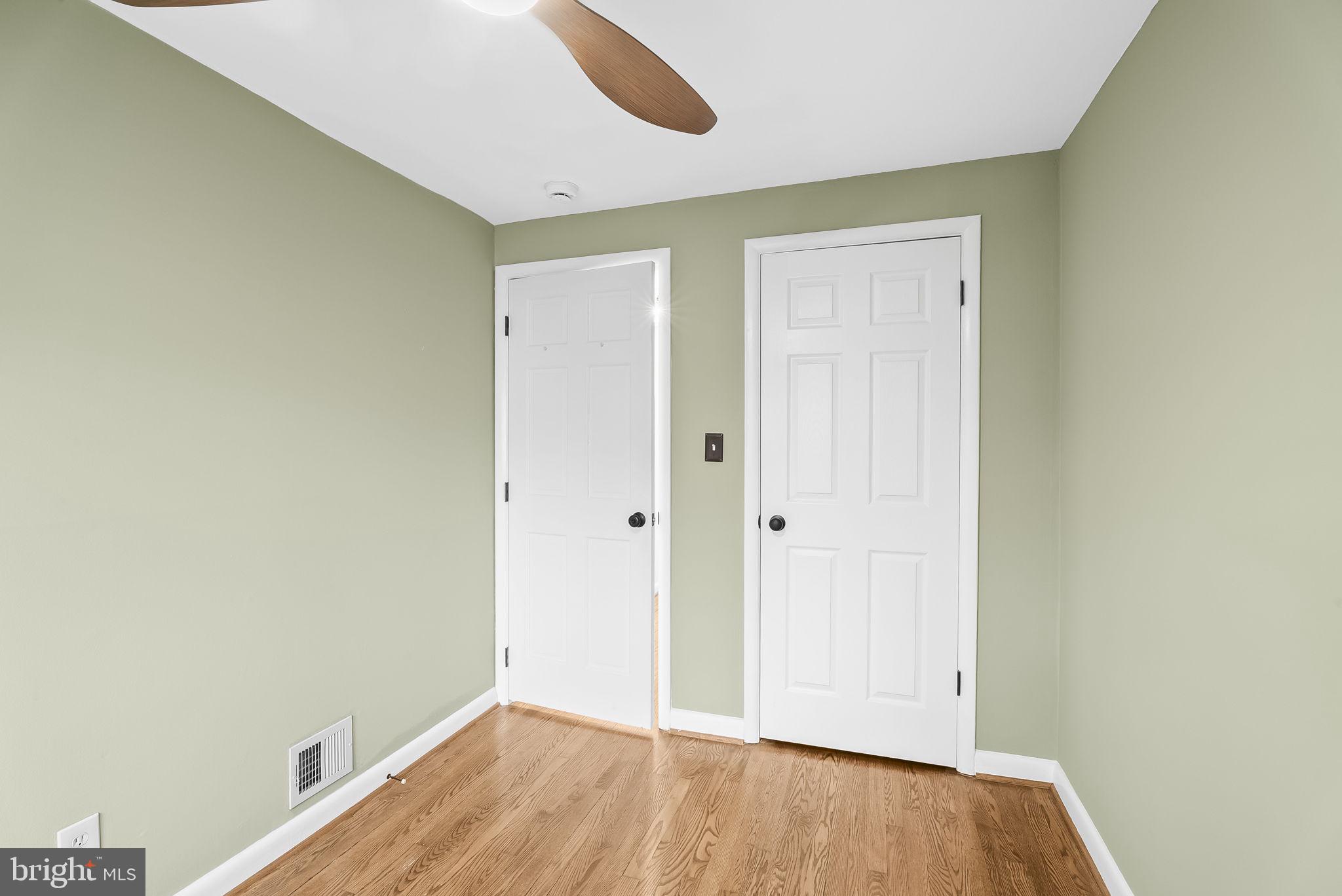 433 Earl Street Alexandria, VA 22314 - Photo 19 of 30 a view of an empty room with wooden floor