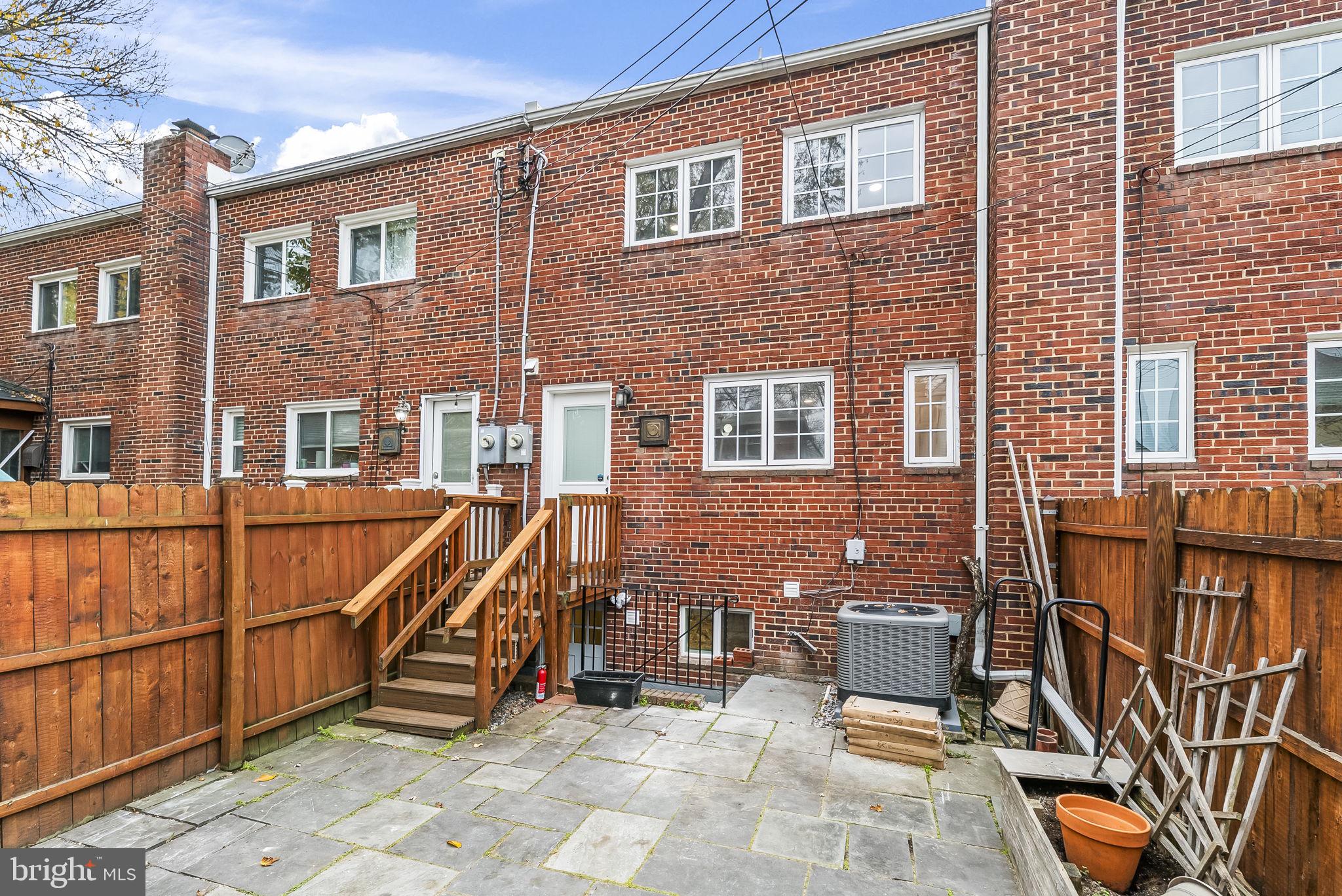 433 Earl Street Alexandria, VA 22314 - Photo 26 of 30 a view of a patio with a table and chairs