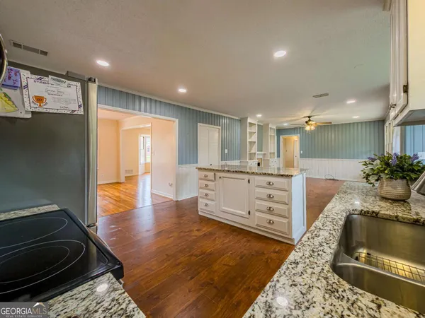 a view of a livingroom with a fireplace and window