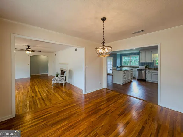 a bathroom with a toilet a sink and a mirror