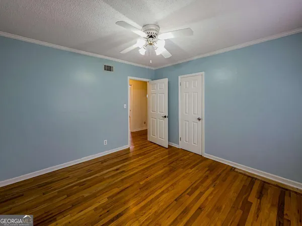 a bedroom with a bed and a shower