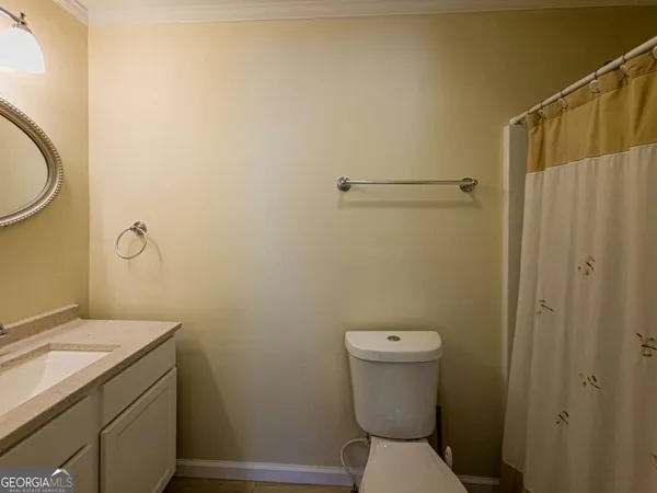 an aerial view of a residential houses with outdoor space