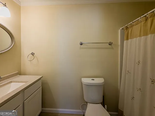 an aerial view of a residential houses with outdoor space