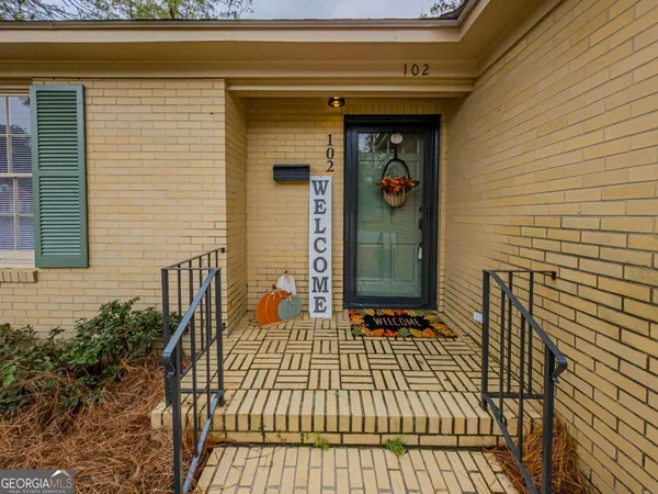 a view of a livingroom with furniture wooden floor and chandelier